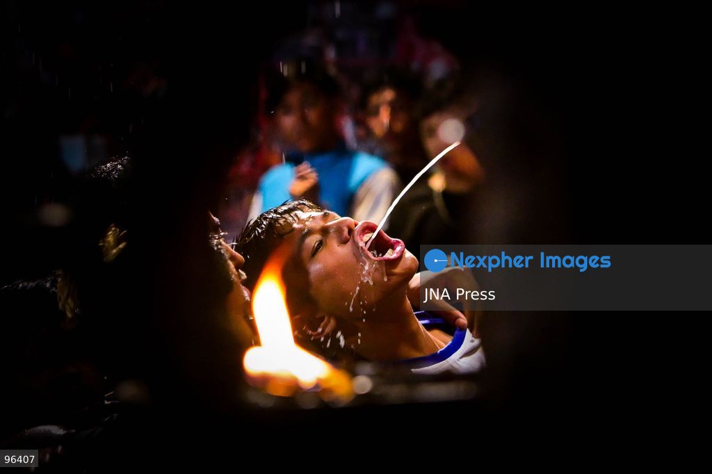 KATHMANDU, NEPAL, SEPTEMBER 24, 2026: Revelers gather around the Swet Bhairab mask to receive rice beer flowing through a brass spout from the deity’s mouth during the second day of the Indra Jatra festival at Kathmandu Durbar Square. The drink is traditionally regarded as a blessing by devotees. Swet Bhairab, a representation of the Hindu deity Bhairava, is displayed publicly during the annual festival and remains covered for much of the rest of the year. Indra Jatra is an eight-day religious and cultural festival featuring processions, masked dances and traditional rituals in Kathmandu. Photo by Safal Prakash Shrestha / JNA Press. (Photo by Safal Prakash Shrestha/JNA Press via Nexpher Images)