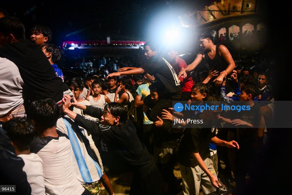 KATHMANDU, NEPAL, SEPTEMBER 24, 2026: Revelers gather around the Swet Bhairab mask to receive rice beer flowing through a brass spout from the deity’s mouth during the second day of the Indra Jatra festival at Kathmandu Durbar Square. The drink is traditionally regarded as a blessing by devotees. Swet Bhairab, a representation of the Hindu deity Bhairava, is displayed publicly during the annual festival and remains covered for much of the rest of the year. Indra Jatra is an eight-day religious and cultural festival featuring processions, masked dances and traditional rituals in Kathmandu. Photo by Safal Prakash Shrestha / JNA Press. (Photo by Safal Prakash Shrestha/JNA Press via Nexpher Images)