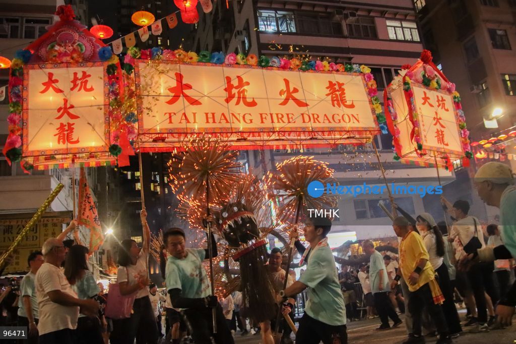 A general view shows the 67-metre-long fire dragon, bristling with thousands of burning incense sticks, parading through Wun Sha Street and the narrow alleys of Tai Hang amidst dense crowds on September 24, 2026 in Hong Kong. The centenary tradition, inscribed on the National List of Intangible Cultural Heritage, marks the festive celebration of the Mid-Autumn Festival. (Photo by Gordon Choi/TMHK via Nexpher Images)