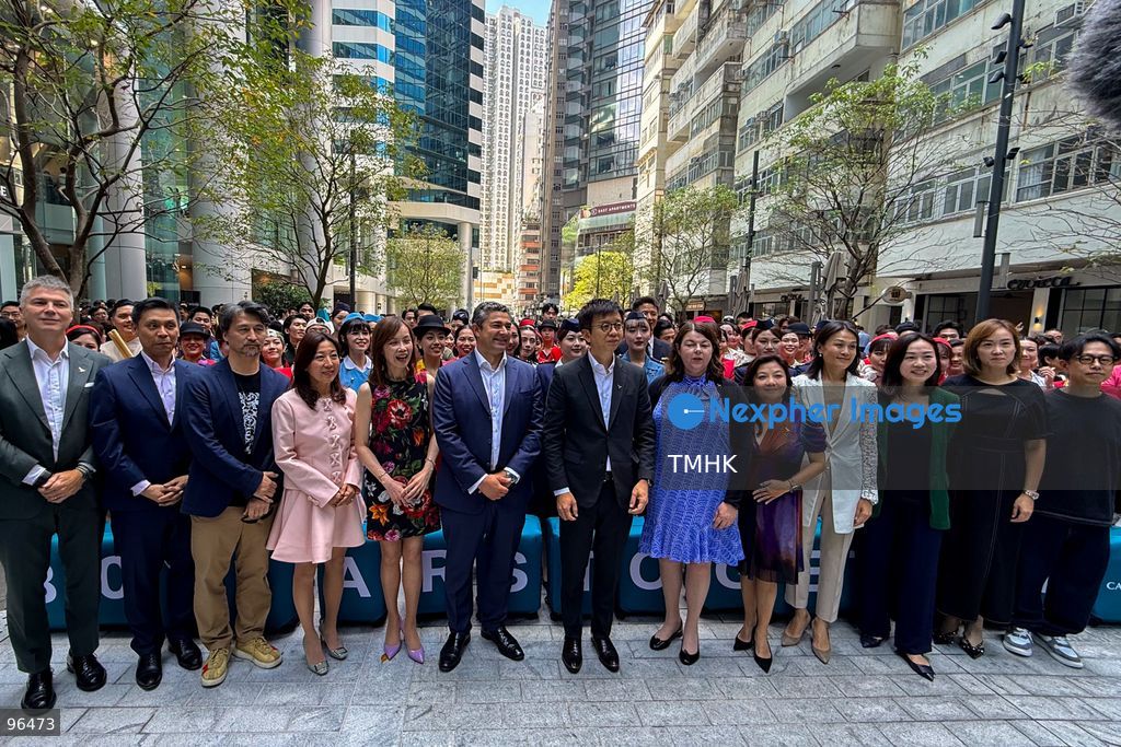 Cathay Pacific Chief Executive Officer Ronald Lam Siu-por, Chief Customer and Commercial Officer Lavinia Lau Hoi-sze, and Chief Financial Officer Rebecca Sharpe pose for a group photograph with participating cabin crew, frontline staff, and dancers following an 80th anniversary dance performance at Taikoo Place on September 24, 2026 in Hong Kong. (Photo by Zulu Lo/TMHK via Nexpher Images)