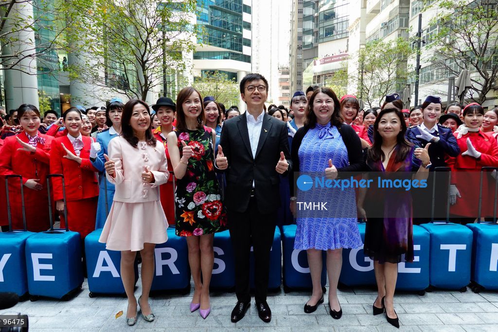 Cathay Pacific Chief Executive Officer Ronald Lam Siu-por, Chief Customer and Commercial Officer Lavinia Lau Hoi-sze, and Chief Financial Officer Rebecca Sharpe pose for a group photograph with participating cabin crew, frontline staff, and dancers following an 80th anniversary dance performance at Taikoo Place on September 24, 2026 in Hong Kong. (Photo by Zulu Lo/TMHK via Nexpher Images)