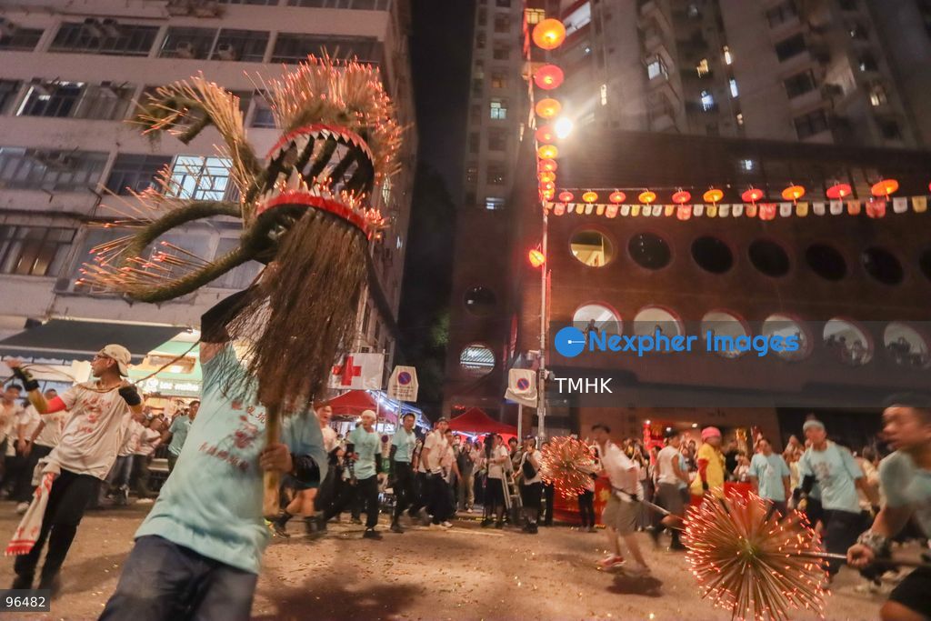 A general view shows the 67-metre-long fire dragon, bristling with thousands of burning incense sticks, parading through Wun Sha Street and the narrow alleys of Tai Hang amidst dense crowds on September 24, 2026 in Hong Kong. The centenary tradition, inscribed on the National List of Intangible Cultural Heritage, marks the festive celebration of the Mid-Autumn Festival. (Photo by Gordon Choi/TMHK via Nexpher Images)