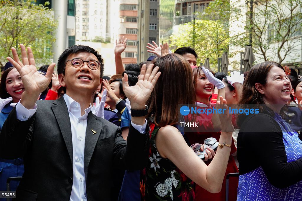 Cathay Pacific Chief Executive Officer Ronald Lam Siu-por, Chief Customer and Commercial Officer Lavinia Lau Hoi-sze, and Chief Financial Officer Rebecca Sharpe wave to crowds of spectators and employees gathered to watch the airline's 80th anniversary showcase at Taikoo Place on September 24, 2026 in Hong Kong. (Photo by Zulu Lo/TMHK via Nexpher Images)