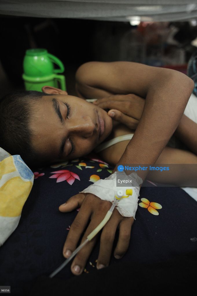 A patient receives treatment in the dengue ward at Chattogram Medical College Hospital (CMCH) amid a surge in cases across Bangladesh. According to hospital personnel, CMCH has admitted an average of 75 dengue patients daily over the past week, with many arriving from upazilas like Sitakunda, Karnaphuli, and Banshkhali after suffering from severe fever for three to eight days. (Photo by Md Rafayat Haque Khan/ Eyepix Group) (Photo by Md Rafayat Haque Khan/ Eyepix Group/Eyepix via Nexpher Images)
