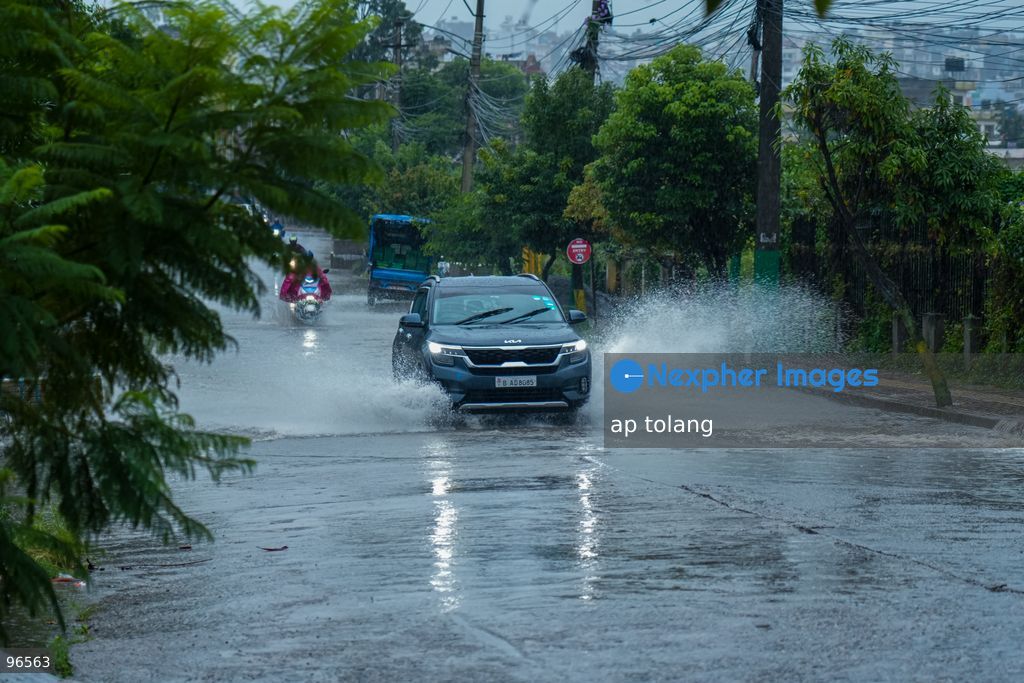 KATHMANDU, NEPAL —September 25, 2026: Heavy rainfall has caused water to overflow onto roads, disrupting the daily lives of residents and hindering vehicle movement in the Khumaltar area of Lalitpur, Nepal. The rainfall has disrupted daily activities as a deep depression over the Bay of Bengal continues to influence weather conditions in the region. (Photo by ap tolang/Nexpher Images)