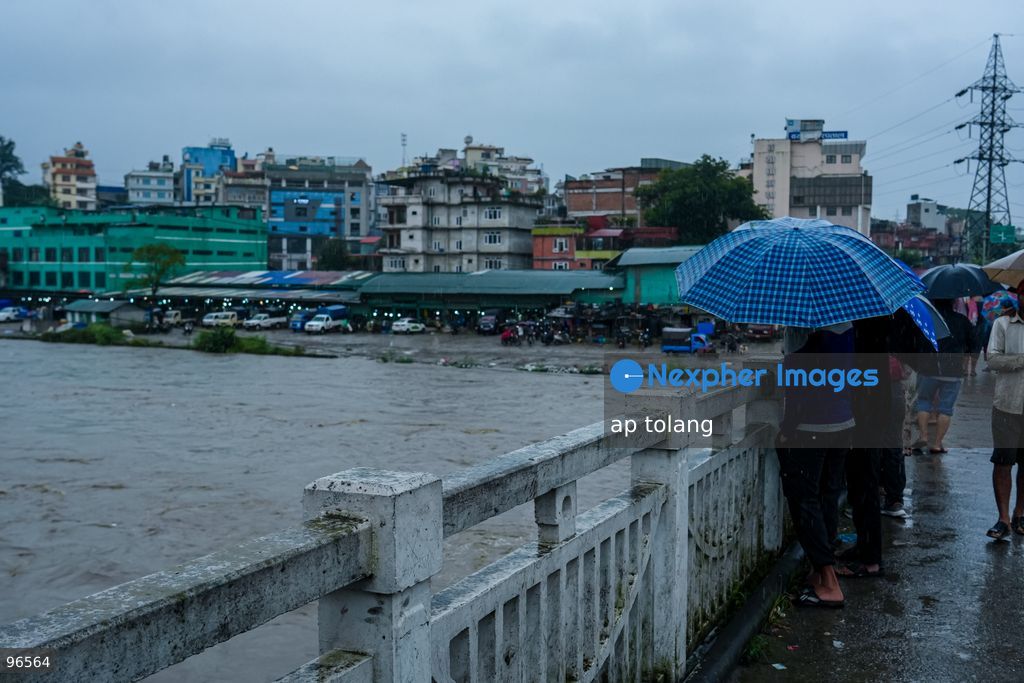 KATHMANDU, NEPAL —September 25, 2026: People walk along a street carrying umbrellas amid heavy rainfall in Lalitpur, Nepal. The rainfall has disrupted daily activities as a deep depression over the Bay of Bengal continues to influence weather conditions in the region. (Photo by ap tolang/Nexpher Images)