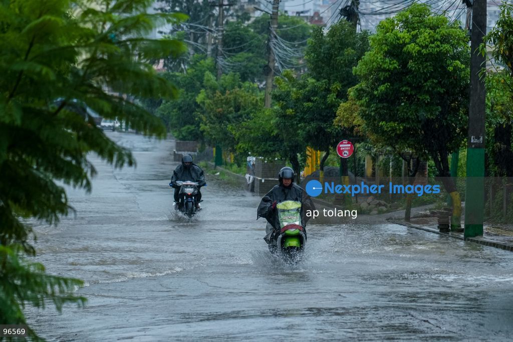 KATHMANDU, NEPAL —September 25, 2026: Heavy rainfall has caused water to overflow onto roads, disrupting the daily lives of residents and hindering vehicle movement in the Khumaltar area of Lalitpur, Nepal. The rainfall has disrupted daily activities as a deep depression over the Bay of Bengal continues to influence weather conditions in the region. (Photo by ap tolang/Nexpher Images)
