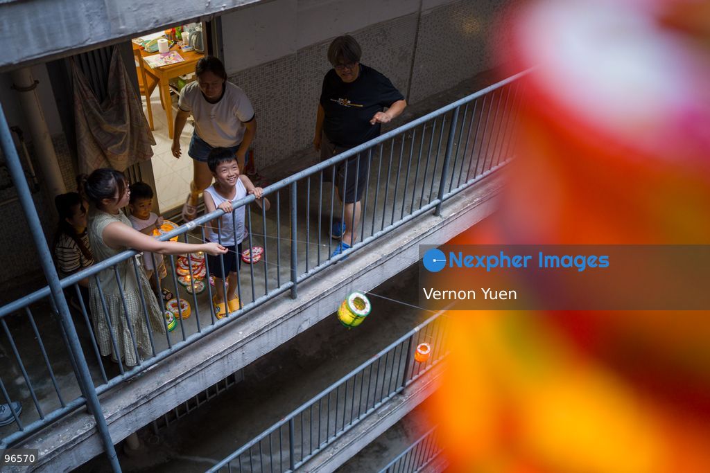 Residents handing Lanterns from a balcony at a housing estate on September 25, 2026 in Hong Kong. (Photo by Vernon Yuen/Nexpher Images)