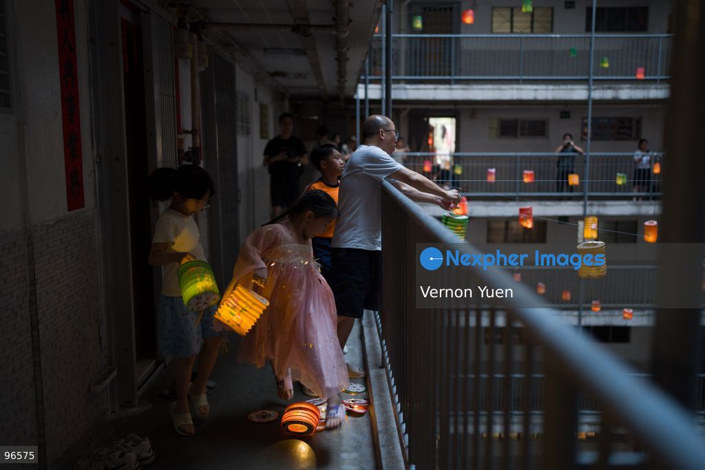 Residents handing Lanterns from a balcony at a housing estate on September 25, 2026 in Hong Kong. (Photo by Vernon Yuen/Nexpher Images)