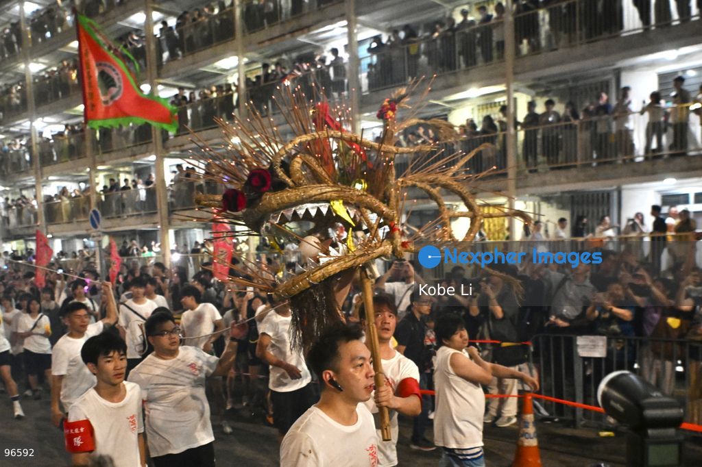 Performers performing the fire dragon dance in Wah Fu Estate at Mid-autumn Festival on September 25, 2026 in Hong Kong. (Photo by Kobe Li/Nexpher Images)
