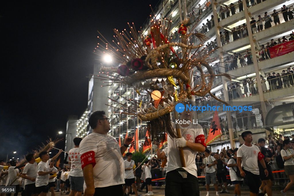 Performers performing the fire dragon dance in Wah Fu Estate at Mid-autumn Festival on September 25, 2026 in Hong Kong. (Photo by Kobe Li/Nexpher Images)
