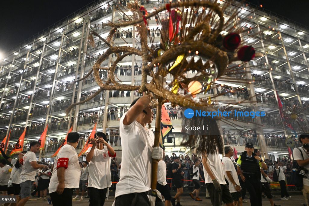 Performers performing the fire dragon dance in Wah Fu Estate at Mid-autumn Festival on September 25, 2026 in Hong Kong. (Photo by Kobe Li/Nexpher Images)
