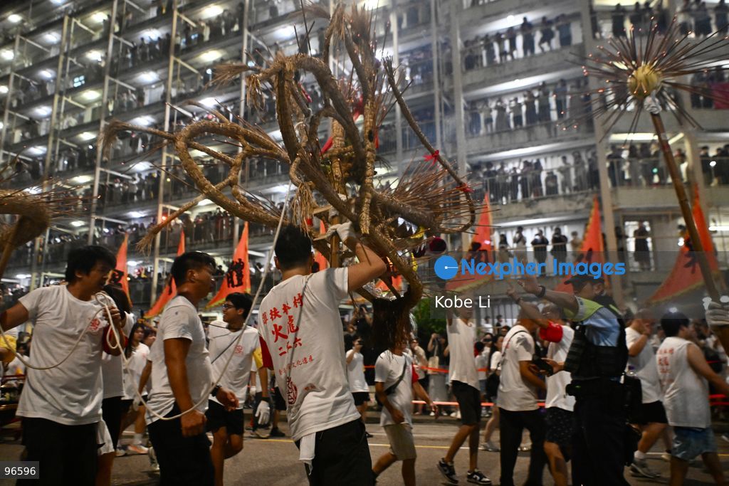 Performers performing the fire dragon dance in Wah Fu Estate at Mid-autumn Festival on September 25, 2026 in Hong Kong. (Photo by Kobe Li/Nexpher Images)