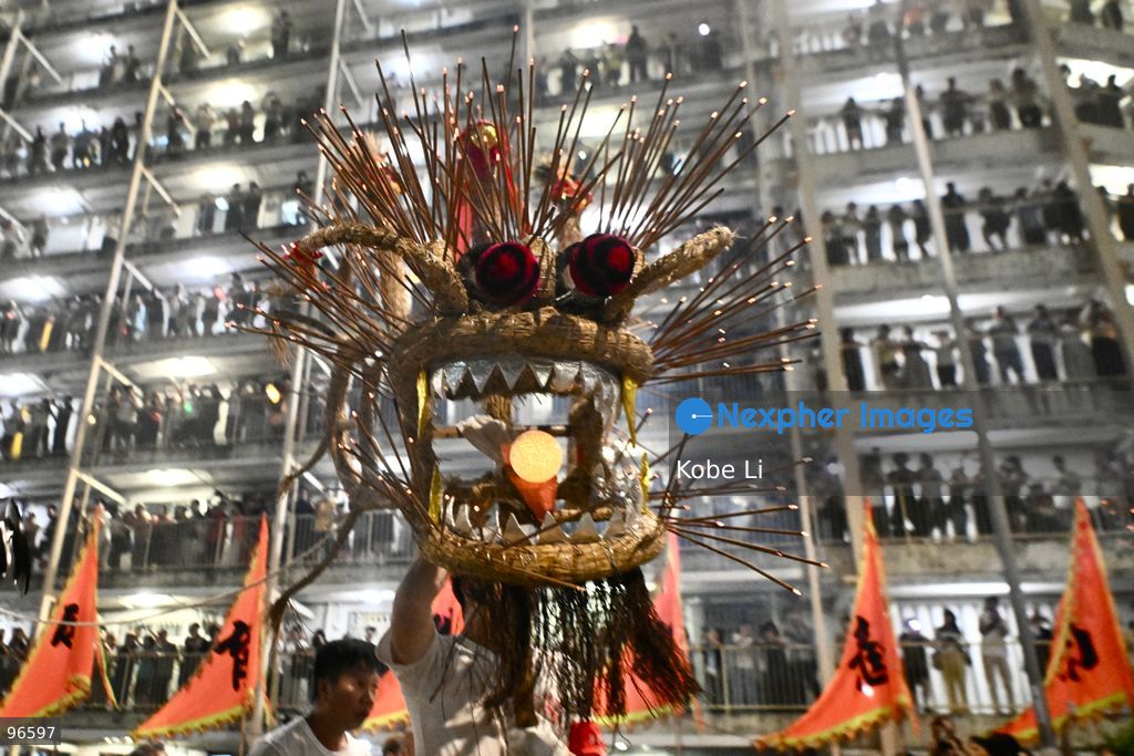 Performers performing the fire dragon dance in Wah Fu Estate at Mid-autumn Festival on September 25, 2026 in Hong Kong. (Photo by Kobe Li/Nexpher Images)