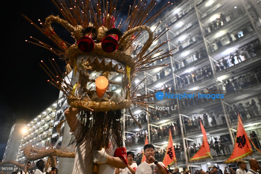 Performers performing the fire dragon dance in Wah Fu Estate at Mid-autumn Festival on September 25, 2026 in Hong Kong. (Photo by Kobe Li/Nexpher Images)