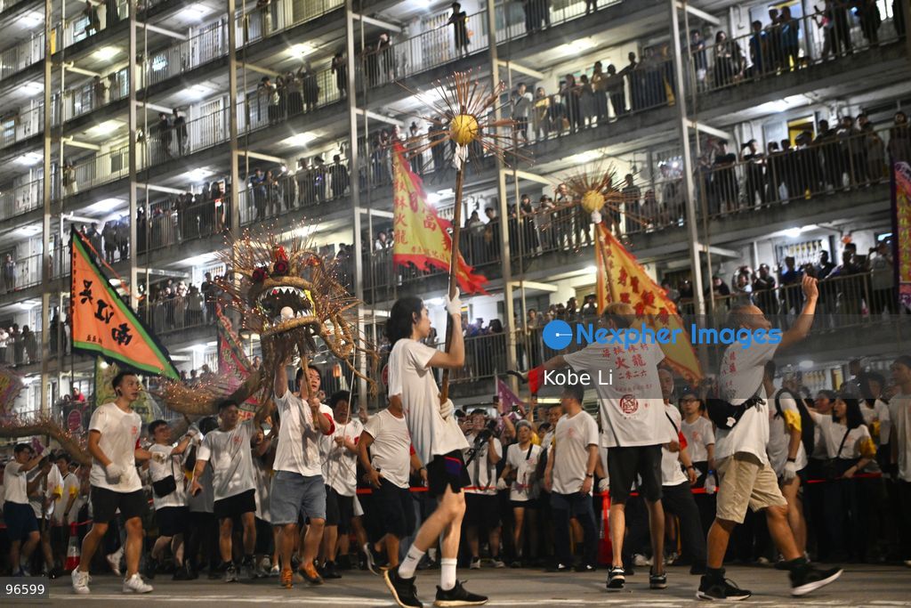 Performers performing the fire dragon dance in Wah Fu Estate at Mid-autumn Festival on September 25, 2026 in Hong Kong. (Photo by Kobe Li/Nexpher Images)