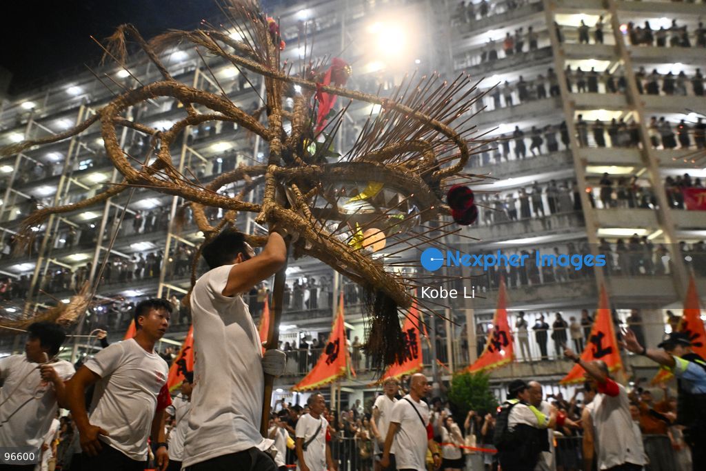 Performers performing the fire dragon dance in Wah Fu Estate at Mid-autumn Festival on September 25, 2026 in Hong Kong. (Photo by Kobe Li/Nexpher Images)