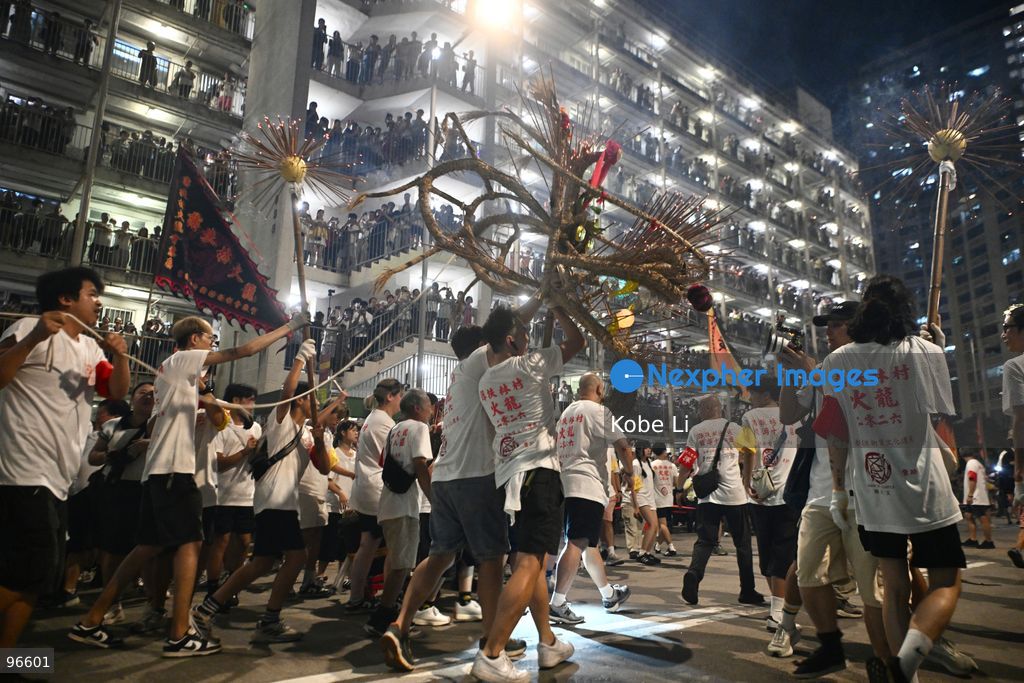 Performers performing the fire dragon dance in Wah Fu Estate at Mid-autumn Festival on September 25, 2026 in Hong Kong. (Photo by Kobe Li/Nexpher Images)