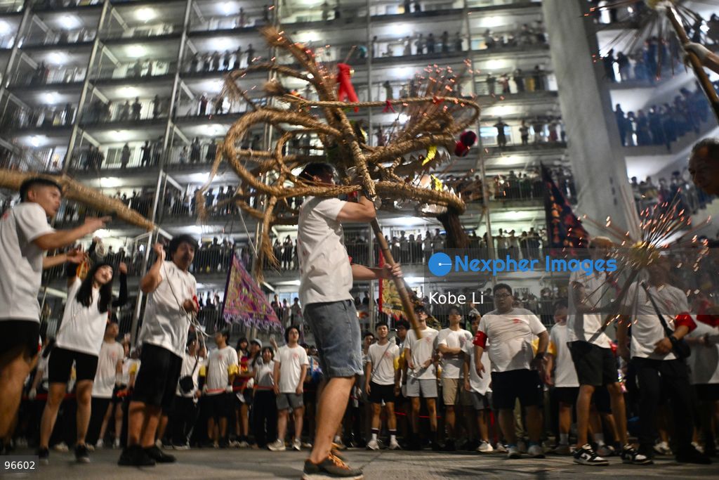 Performers performing the fire dragon dance in Wah Fu Estate at Mid-autumn Festival on September 25, 2026 in Hong Kong. (Photo by Kobe Li/Nexpher Images)
