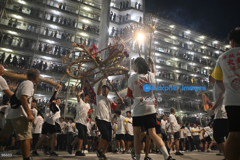 Performers performing the fire dragon dance in Wah Fu Estate at Mid-autumn Festival on September 25, 2026 in Hong Kong. (Photo by Kobe Li/Nexpher Images)