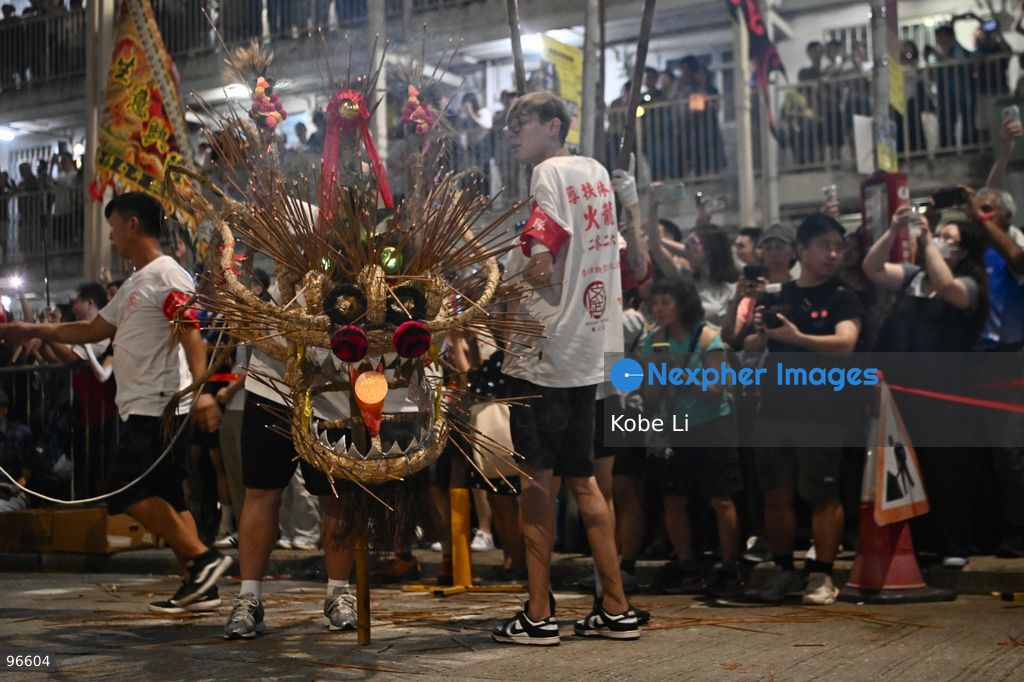 Performers performing the fire dragon dance in Wah Fu Estate at Mid-autumn Festival on September 25, 2026 in Hong Kong. (Photo by Kobe Li/Nexpher Images)