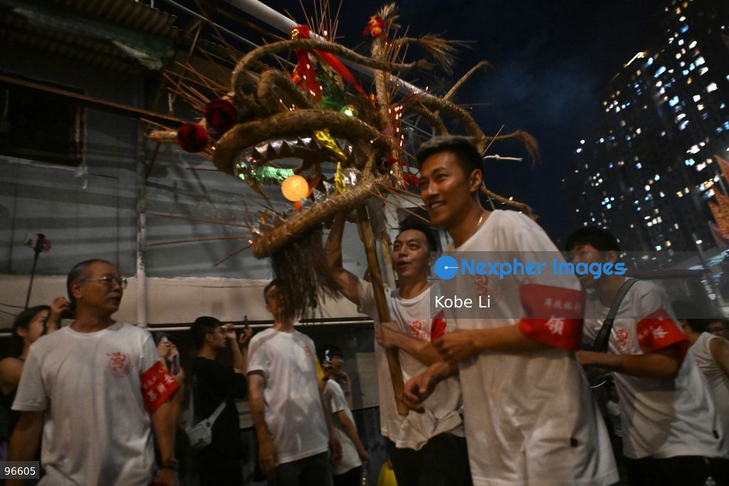 Performers performing the fire dragon dance in Pok Fu Lam Village at Mid-autumn Festival on September 25, 2026 in Hong Kong. (Photo by Kobe Li/Nexpher Images)