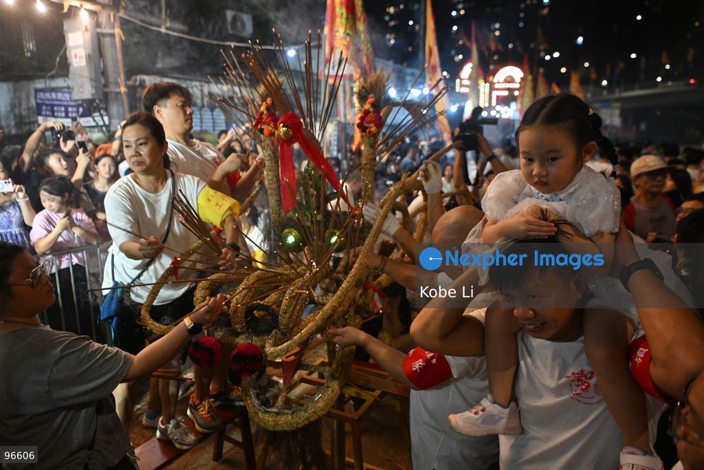 Performers during a fire dragon dance performance in Pok Fu Lam Village at Mid-autumn Festival on September 25, 2026 in Hong Kong. (Photo by Kobe Li/Nexpher Images)
