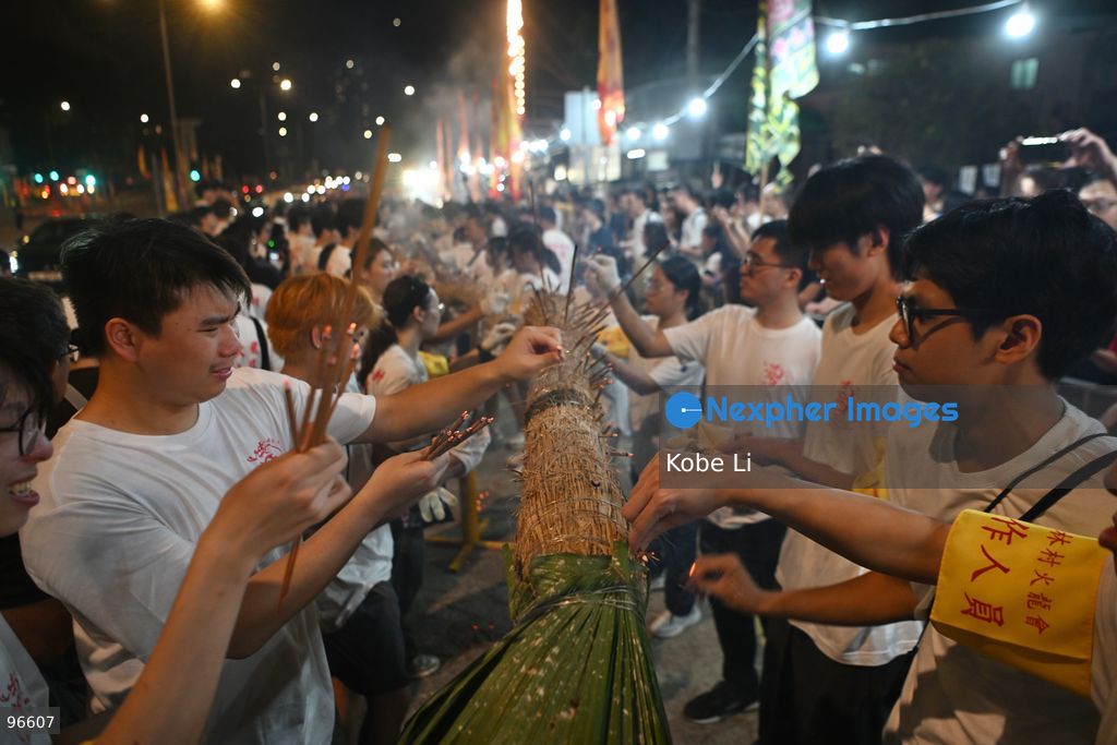 Performers during a fire dragon dance performance in Pok Fu Lam Village at Mid-autumn Festival on September 25, 2026 in Hong Kong. (Photo by Kobe Li/Nexpher Images)