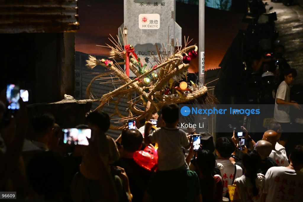 Performers during a fire dragon dance performance in Pok Fu Lam Village at Mid-autumn Festival on September 25, 2026 in Hong Kong. (Photo by Kobe Li/Nexpher Images)