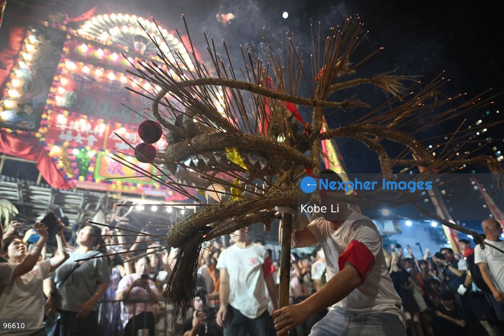 Performers performing the fire dragon dance in Wah Fu Estate at Mid-autumn Festival on September 25, 2026 in Hong Kong. (Photo by Kobe Li/Nexpher Images)