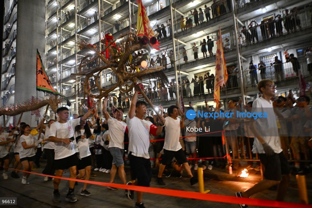 Performers performing the fire dragon dance in Wah Fu Estate at Mid-autumn Festival on September 25, 2026 in Hong Kong. (Photo by Kobe Li/Nexpher Images)