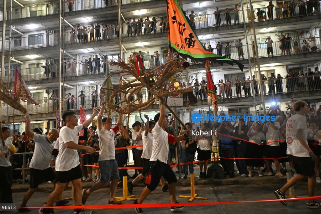 Performers performing the fire dragon dance in Wah Fu Estate at Mid-autumn Festival on September 25, 2026 in Hong Kong. (Photo by Kobe Li/Nexpher Images)