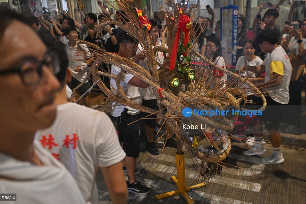Performers performing the fire dragon dance in Wah Fu Estate at Mid-autumn Festival on September 25, 2026 in Hong Kong. (Photo by Kobe Li/Nexpher Images)
