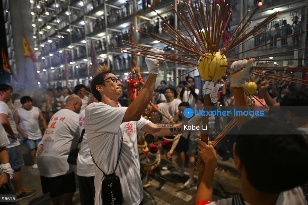 Performers performing the fire dragon dance in Wah Fu Estate at Mid-autumn Festival on September 25, 2026 in Hong Kong. (Photo by Kobe Li/Nexpher Images)