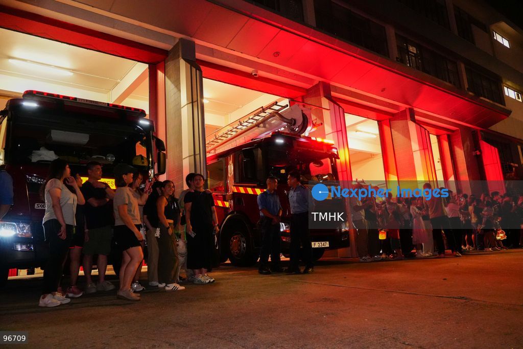 Participants perform the traditional fire dragon dance along Pok Fu Lam Road outside the Pok Fu Lam Fire Station on September 25, 2026 in Hong Kong, bringing vibrant festive cheers and Mid-Autumn blessings to local emergency personnel and onlooking crowds. (Photo by Zulu Lo/TMHK via Nexpher Images)
