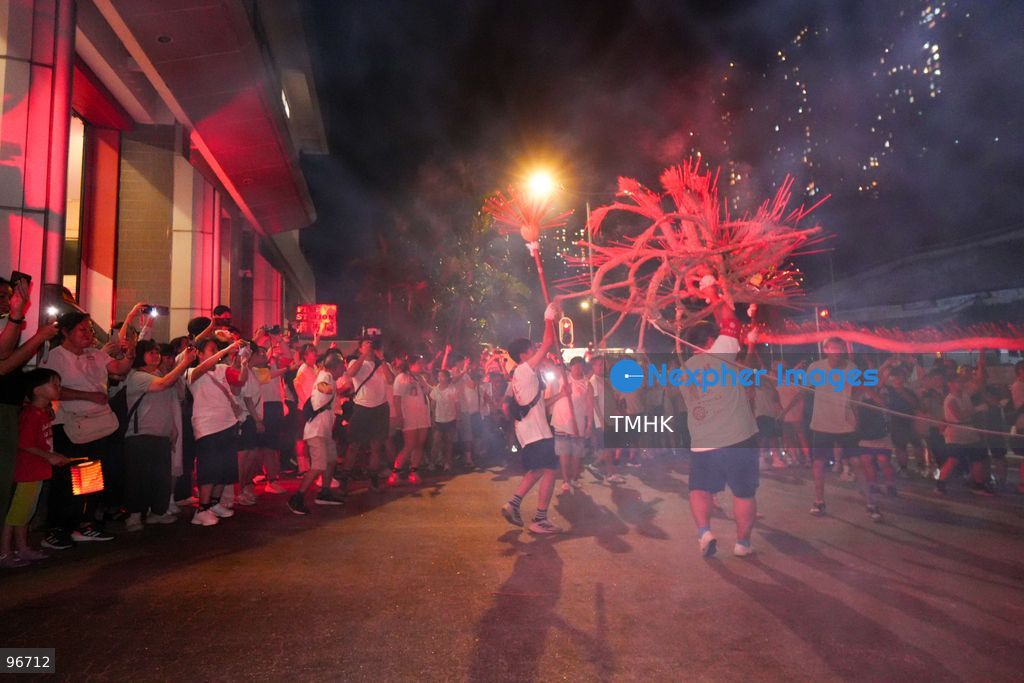 Participants perform the traditional fire dragon dance along Pok Fu Lam Road outside the Pok Fu Lam Fire Station on September 25, 2026 in Hong Kong, bringing vibrant festive cheers and Mid-Autumn blessings to local emergency personnel and onlooking crowds. (Photo by Zulu Lo/TMHK via Nexpher Images)