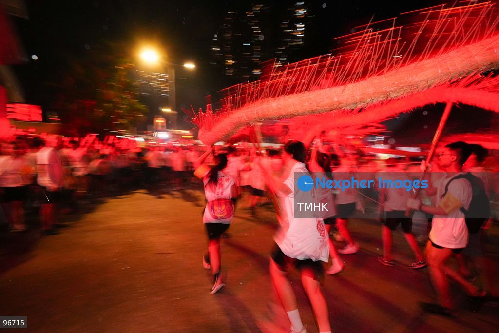 Participants perform the traditional fire dragon dance along Pok Fu Lam Road outside the Pok Fu Lam Fire Station on September 25, 2026 in Hong Kong, bringing vibrant festive cheers and Mid-Autumn blessings to local emergency personnel and onlooking crowds. (Photo by Zulu Lo/TMHK via Nexpher Images)