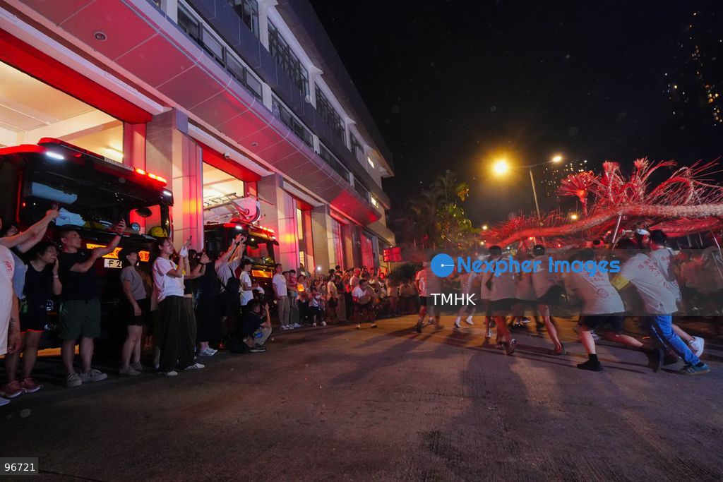 Participants perform the traditional fire dragon dance along Pok Fu Lam Road outside the Pok Fu Lam Fire Station on September 25, 2026 in Hong Kong, bringing vibrant festive cheers and Mid-Autumn blessings to local emergency personnel and onlooking crowds. (Photo by Zulu Lo/TMHK via Nexpher Images)