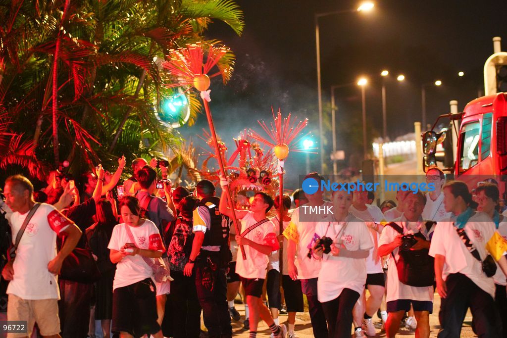 Participants perform the traditional fire dragon dance along Pok Fu Lam Road outside the Pok Fu Lam Fire Station on September 25, 2026 in Hong Kong, bringing vibrant festive cheers and Mid-Autumn blessings to local emergency personnel and onlooking crowds. (Photo by Zulu Lo/TMHK via Nexpher Images)