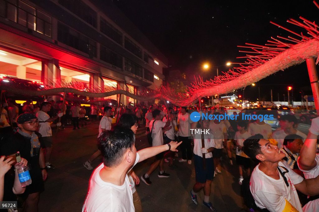 Participants perform the traditional fire dragon dance along Pok Fu Lam Road outside the Pok Fu Lam Fire Station on September 25, 2026 in Hong Kong, bringing vibrant festive cheers and Mid-Autumn blessings to local emergency personnel and onlooking crowds. (Photo by Zulu Lo/TMHK via Nexpher Images)
