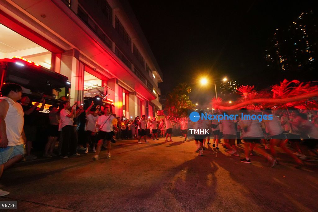 Participants perform the traditional fire dragon dance along Pok Fu Lam Road outside the Pok Fu Lam Fire Station on September 25, 2026 in Hong Kong, bringing vibrant festive cheers and Mid-Autumn blessings to local emergency personnel and onlooking crowds. (Photo by Zulu Lo/TMHK via Nexpher Images)