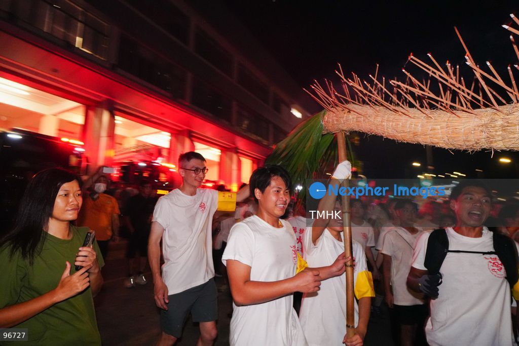 Participants perform the traditional fire dragon dance along Pok Fu Lam Road outside the Pok Fu Lam Fire Station on September 25, 2026 in Hong Kong, bringing vibrant festive cheers and Mid-Autumn blessings to local emergency personnel and onlooking crowds. (Photo by Zulu Lo/TMHK via Nexpher Images)
