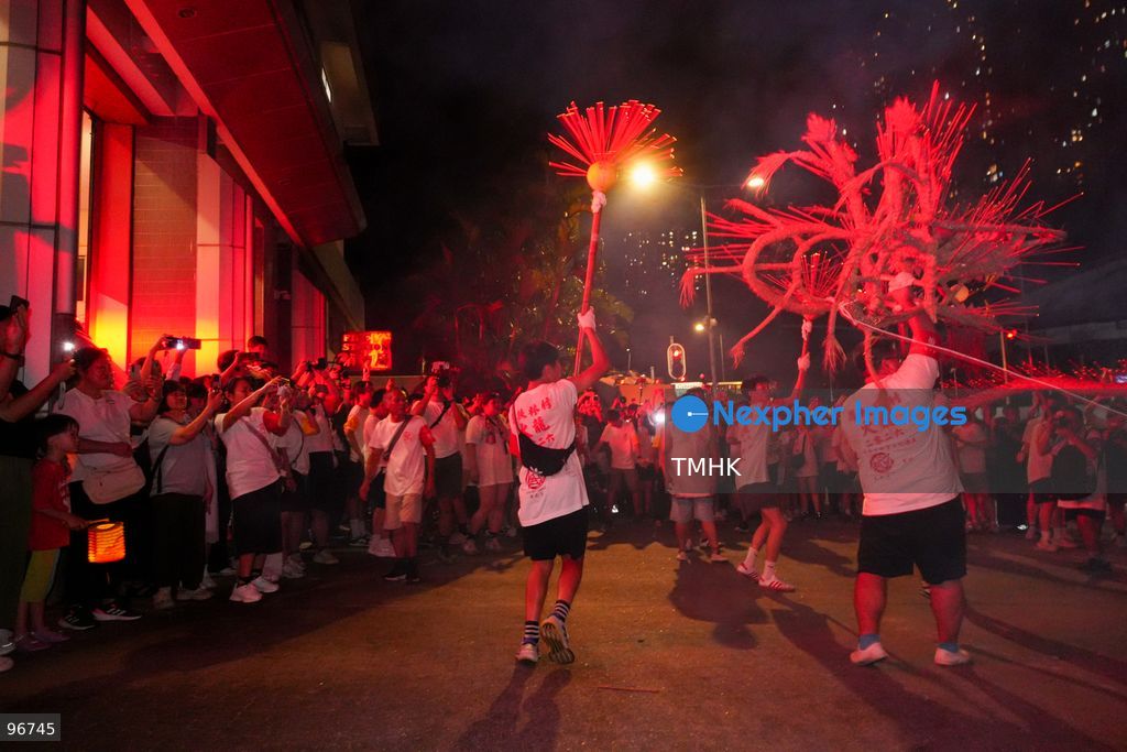 Participants perform the traditional fire dragon dance along Pok Fu Lam Road outside the Pok Fu Lam Fire Station on September 25, 2026 in Hong Kong, bringing vibrant festive cheers and Mid-Autumn blessings to local emergency personnel and onlooking crowds. (Photo by Zulu Lo/TMHK via Nexpher Images)