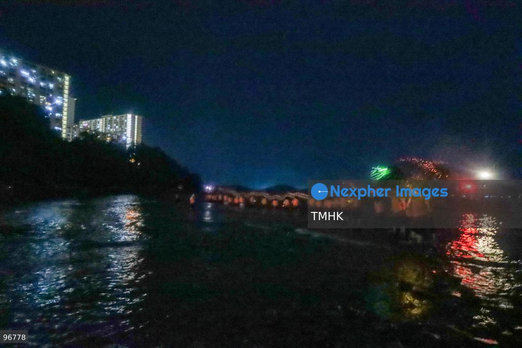 Villagers and performers wade into the waters off Waterfall Bay Park to submerge the 30-metre fire dragon in the sea on September 25, 2026 in Hong Kong, marking the sacred "Dragon Returning to the Sea" ritual as glowing incense sticks extinguish in the surf, signifying the successful completion of the Mid-Autumn blessings. (Photo by Gordon Choi/TMHK via Nexpher Images)