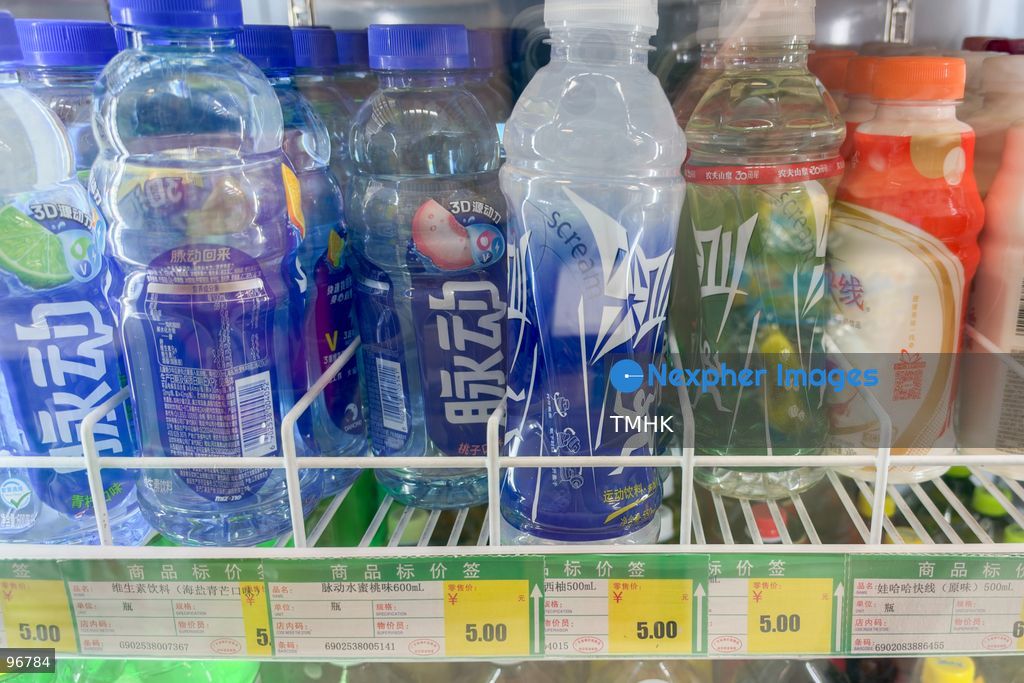 Bottles of Nongfu Spring's "Scream" sports beverage, specifically the second and third bottles from the right, are displayed on a supermarket shelf inside the Liantang Port Commercial City on September 24, 2026 in Shenzhen, China. The brand drew recent public attention after a false scare outside a Hong Kong school sports day, where 16 students felt unwell after drinking freely distributed bottles; official Hong Kong police and government laboratory tests confirmed the bottles were completely intact with no poison, verifying that tiny label holes were standard factory tear-lines and clearing the manufacturer and its packaging of any defect or tampering. (Photo by Kevin Li/TMHK via Nexpher Images)