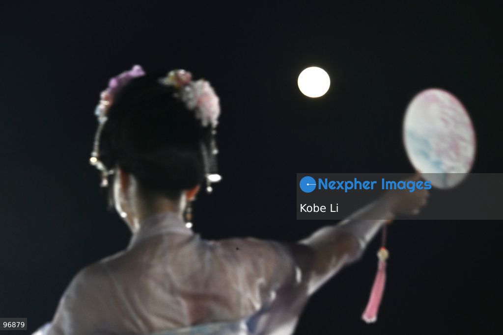 A performer in traditional Hanfu attire poses and a moon in Hung Hom New Waterfront the day after the Mid-Autumn Festival on September 26, 2026 in Hong Kong. (Photo by Kobe Li/Nexpher Images)