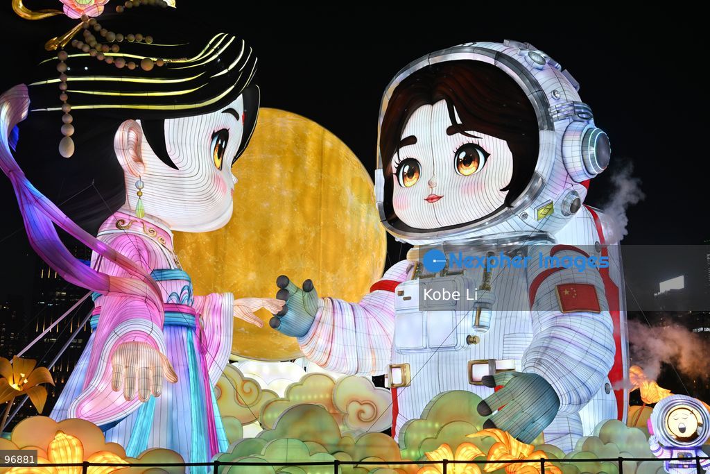 Large illuminated figures depicting a traditional Hanfu and an astronaut are displayed during a nighttime event in Hung Hom New Waterfront, the day after the Mid-Autumn Festival on September 26, 2026 in Hong Kong. (Photo by Kobe Li/Nexpher Images)