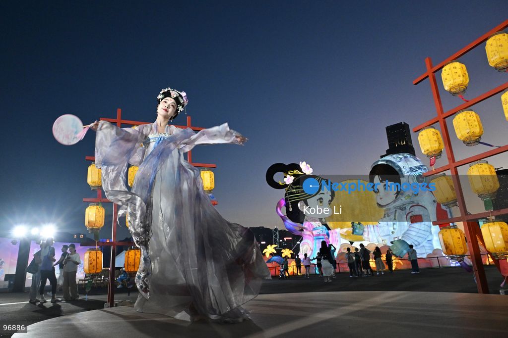 A performer in traditional Hanfu attire performs in Hung Hom New Waterfront the day after the Mid-Autumn Festival on September 26, 2026 in Hong Kong. (Photo by Kobe Li/Nexpher Images)