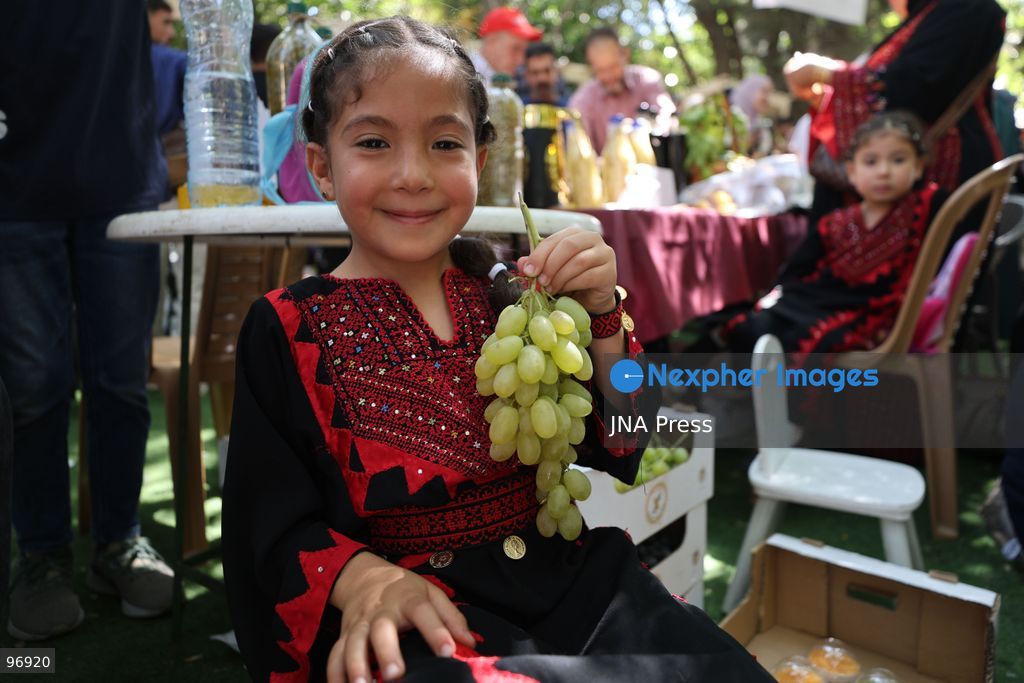 HEBRON, OCCUPIED WEST BANK, SEPTEMBER 26, 2026: Palestinian visitors attend the opening of a grape market in the Old City of Hebron. Local farmers and producers display grapes and grape-based products during the event, highlighting a crop traditionally associated with agriculture in the Hebron area. Photo by Mosab Shawer / JNA Press. (Photo by Mosab shawer/JNA Press via Nexpher Images)