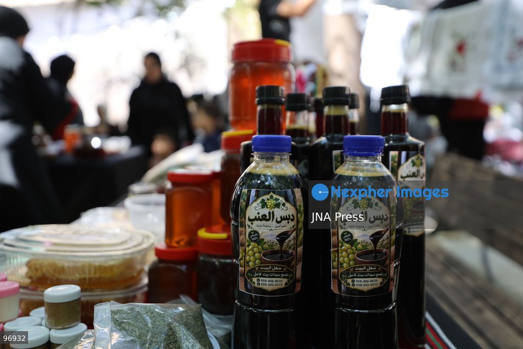HEBRON, OCCUPIED WEST BANK, SEPTEMBER 26, 2026: Palestinian visitors attend the opening of a grape market in the Old City of Hebron. Local farmers and producers display grapes and grape-based products during the event, highlighting a crop traditionally associated with agriculture in the Hebron area. Photo by Mosab Shawer / JNA Press. (Photo by Mosab shawer/JNA Press via Nexpher Images)